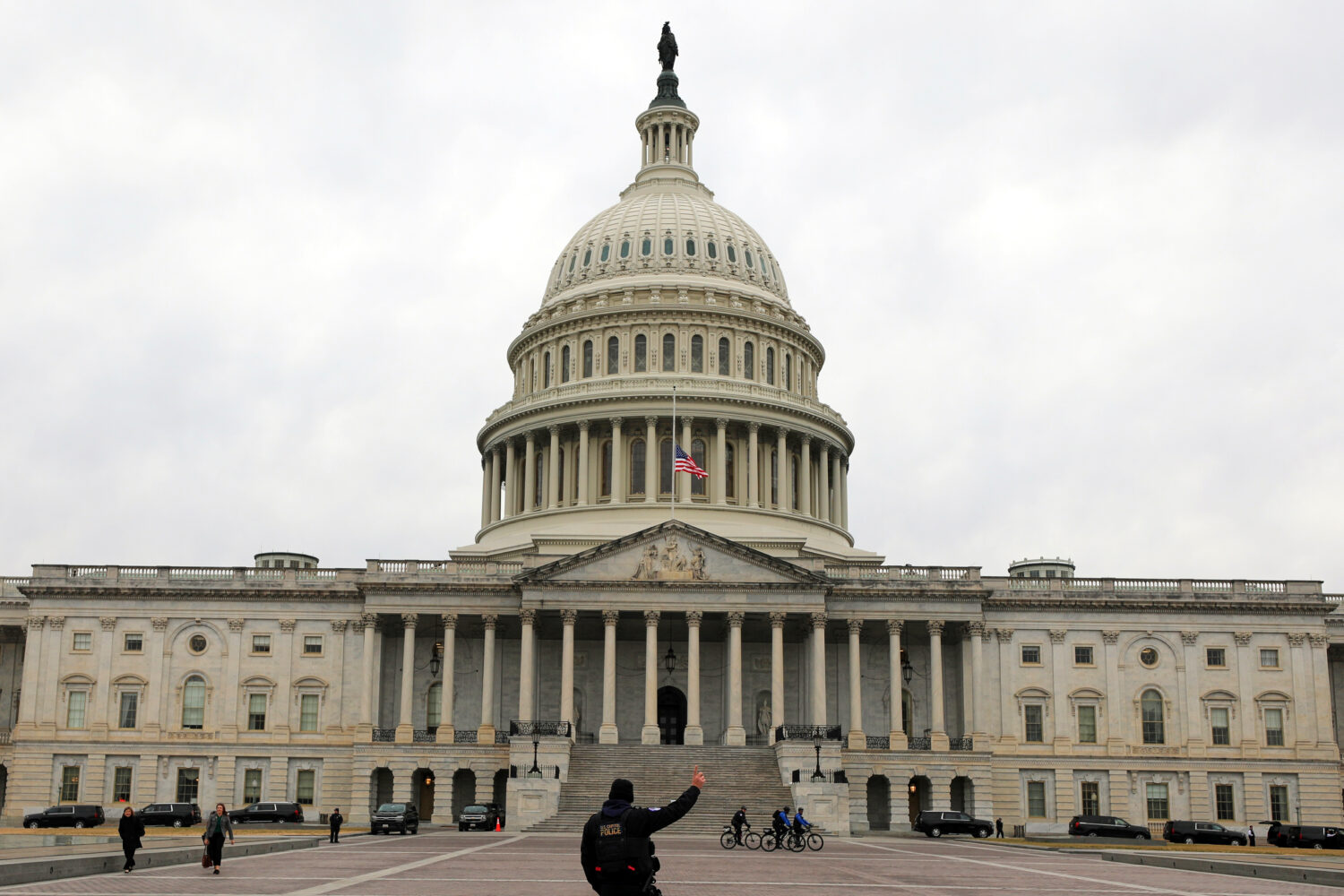 A U.S. Capitol Police officer patrols on the East Front of the U.S. Capitol, Wednesday, Jan. 14, 20...