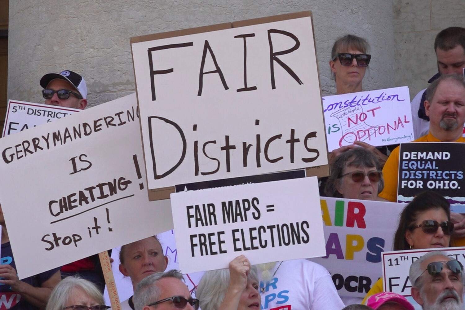 FILE - This photo taken from video shows organizers rallying outside of the Ohio Statehouse to prot...
