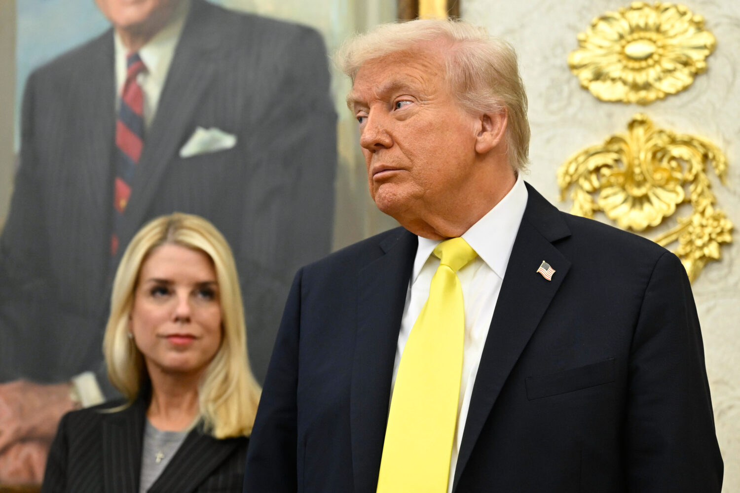 FILE - President Donald Trump and Attorney General Pam Bondi listen as FBI Director Kash Patel spea...