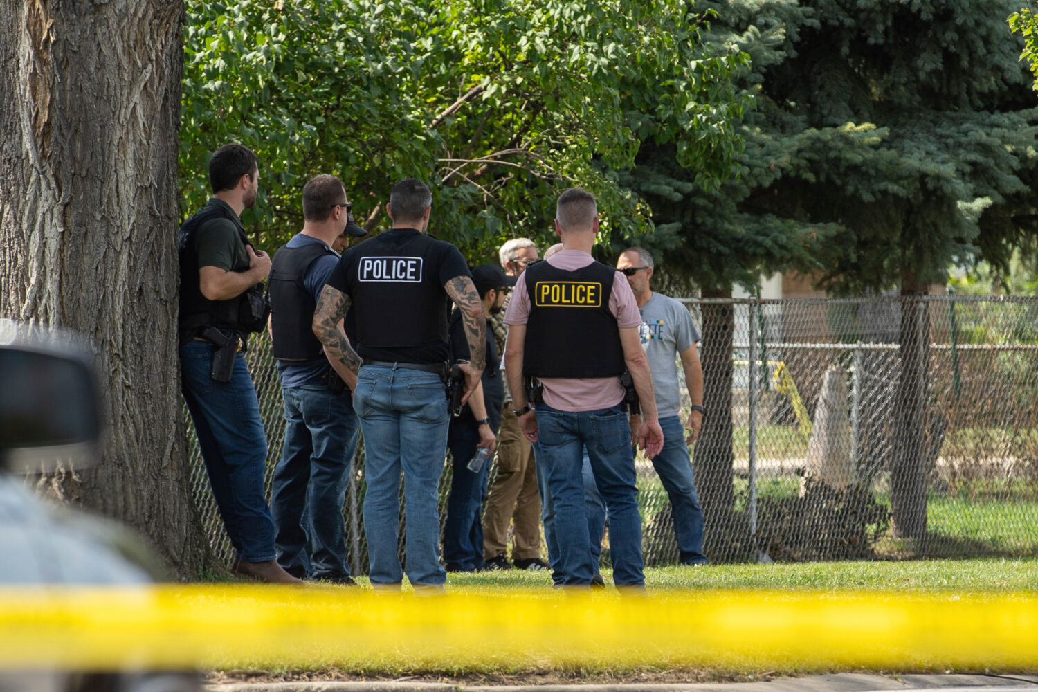 FILE - Law enforcement personnel investigate after the Department of Homeland Security said an Immi...