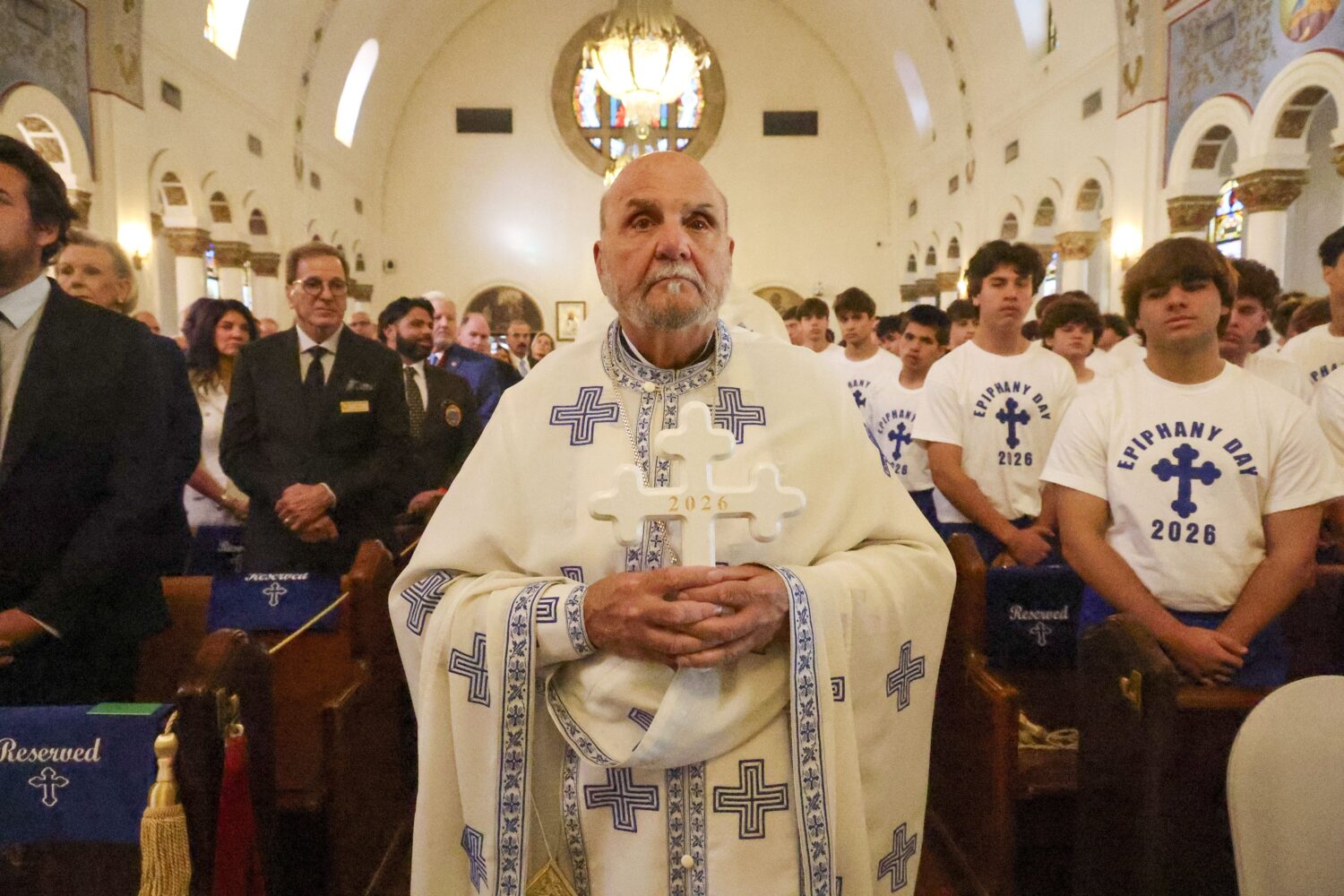 Fr. Michael Kouremetis transports the Epiphany Cross into the Saint Nicholas Greek Orthodox Cathedr...
