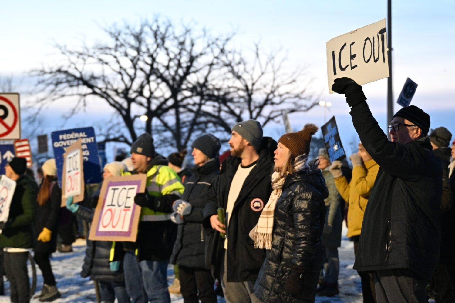 Protesters gather outside the Bishop Henry Whipple Federal Building, Thursday, Jan. 8, 2026, in Min...