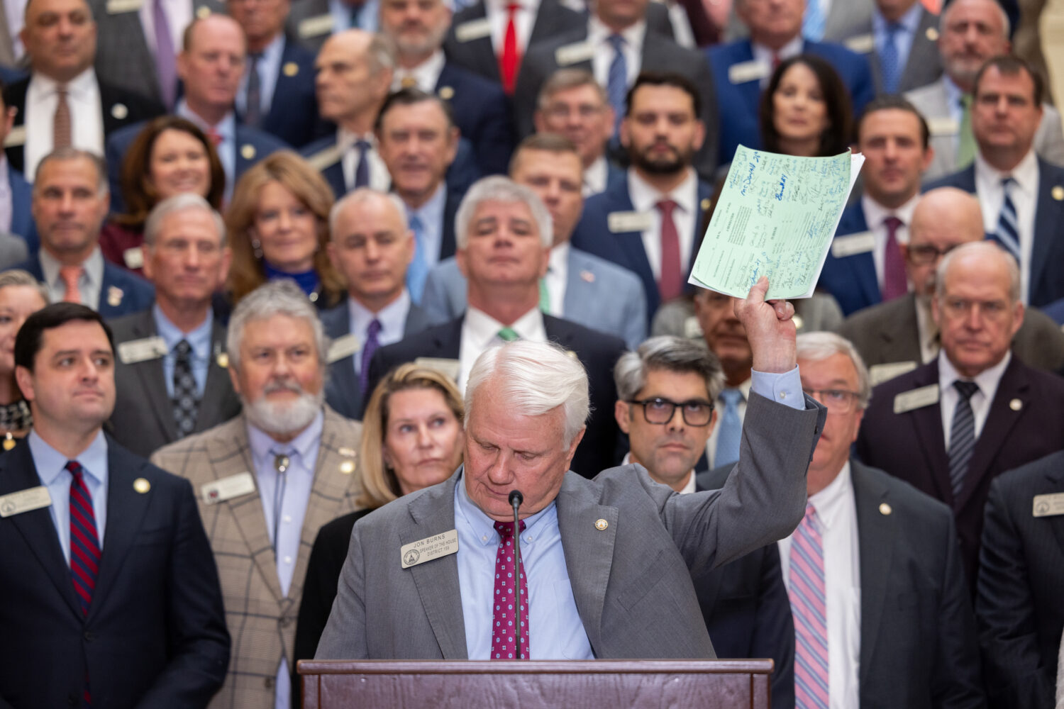 House Speaker Jon Burns holds up proposed property tax relief legislation during a press conference...