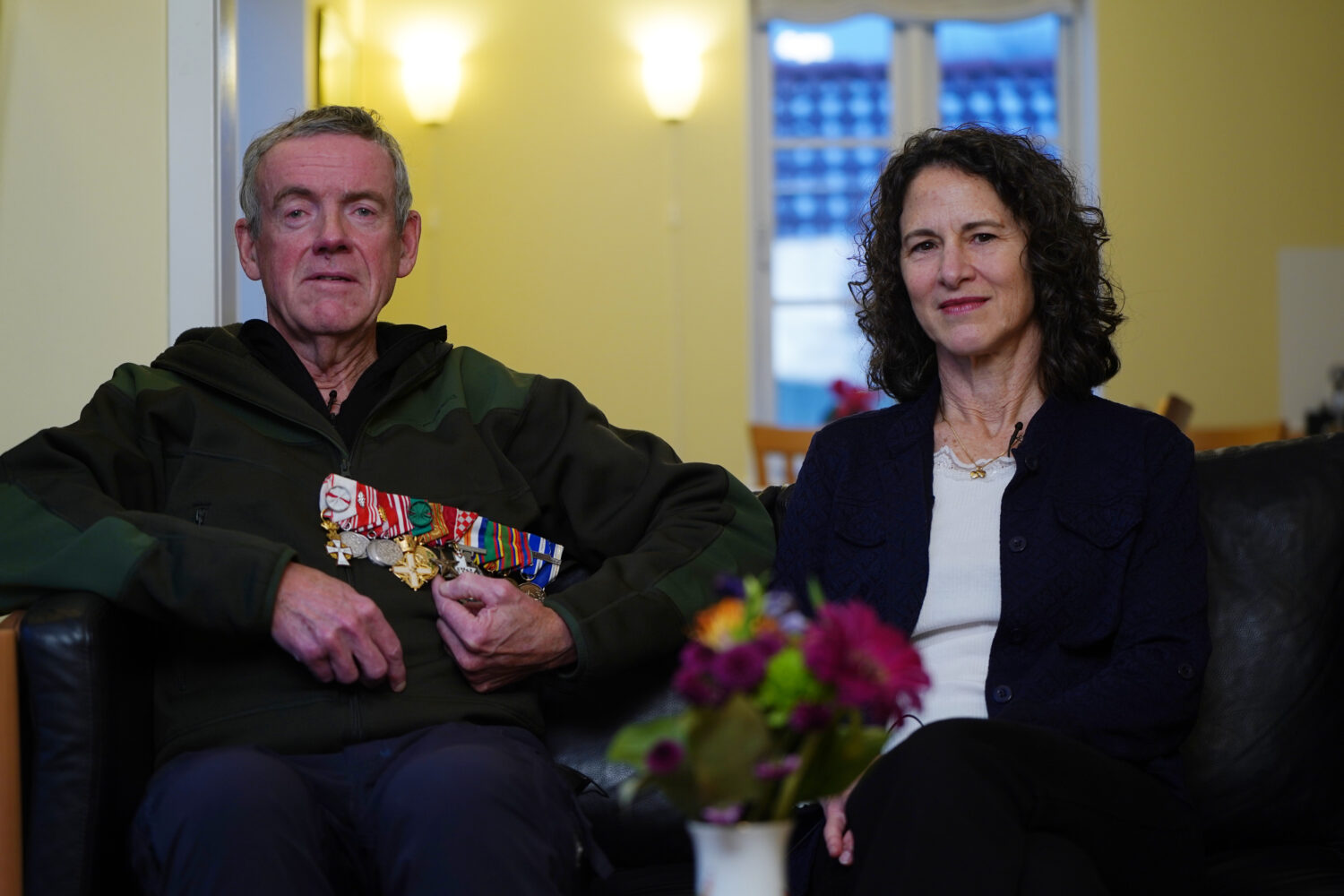 Former Colonel Soren Knudsen and his wife Gina Schaar pose for a photo during an interview with The...