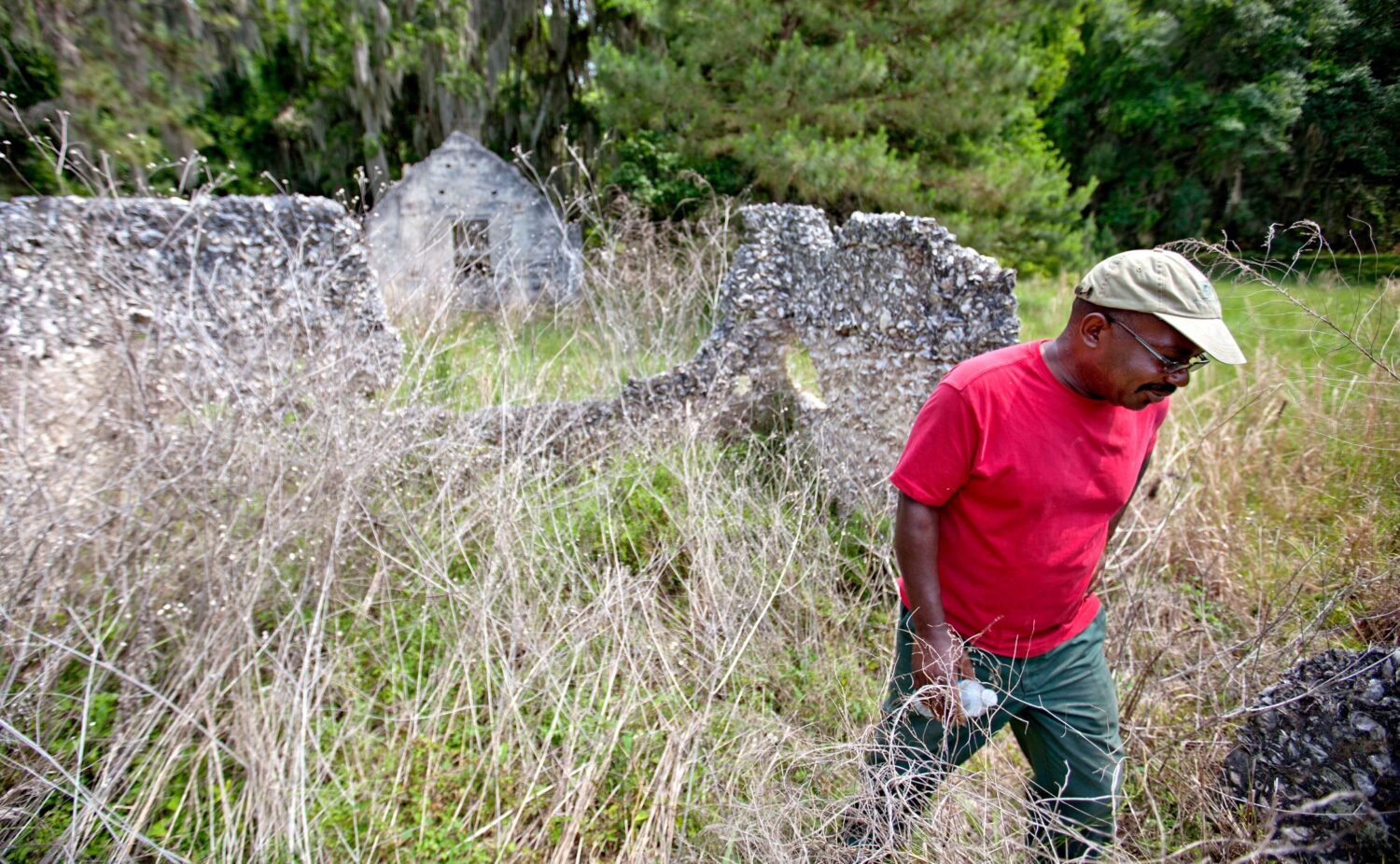 FILE - Ire Gene Grovner walks through remnants of the old slave's quarters at the Chocolate Plantat...