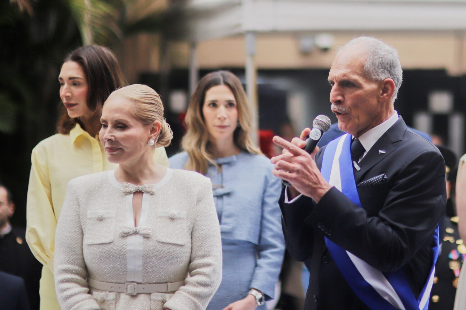 Honduran President Nasry Asfura speaks next to his wife, first lady Lissette del Cid, after his ina...