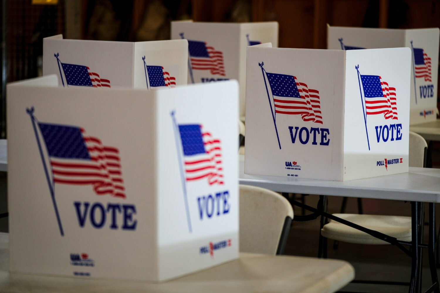 FILE- Voting booths are set up at a polling place in Newtown, Pa, April 23, 2024. (AP Photo/Matt Ro...