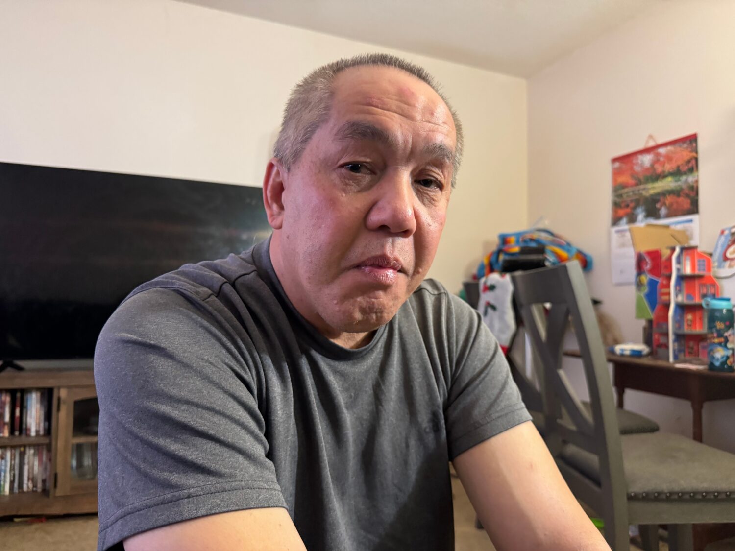 Chongly "Scott" Thao, a U.S. citizen, sits for a photo at his home Monday, Jan. 19, 2026, in St. Pa...