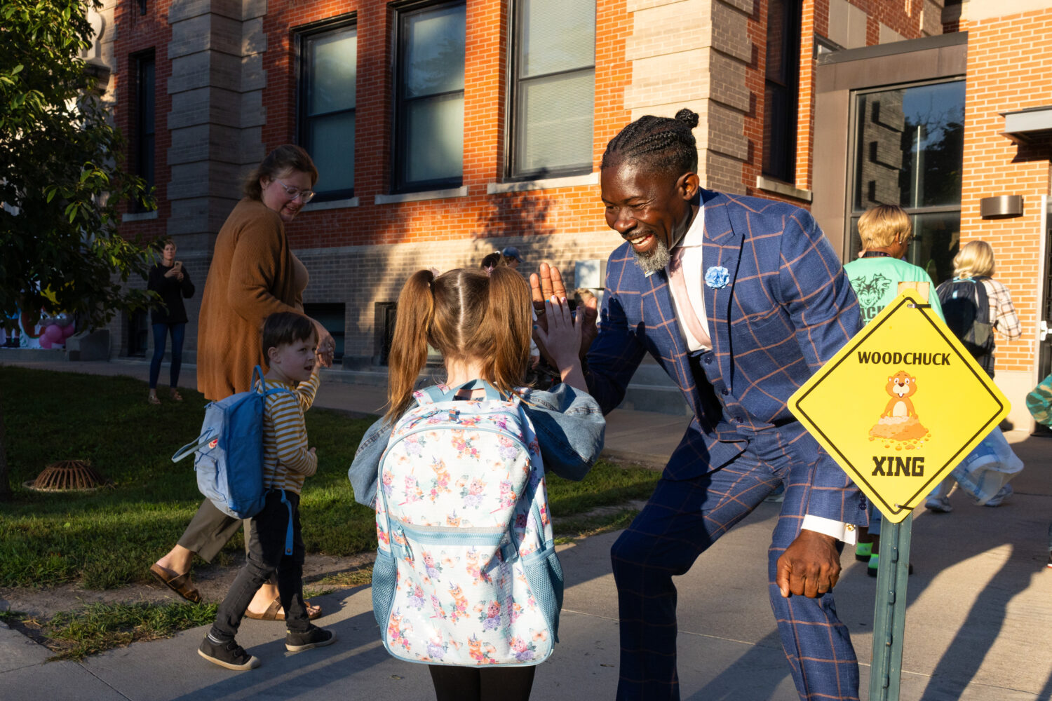 FILE - Ian Roberts, superintendent of Des Moines Public Schools, greets students at Greenwood Eleme...