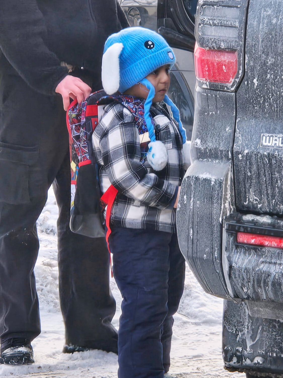 Liam Conejo Ramos, 5, is detained by U.S. Immigration and Customs Enforcement officers after arrivi...