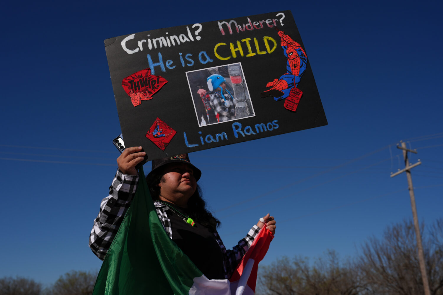 Protesters gather outside the South Texas Family Residential Center detention facility where Liam R...