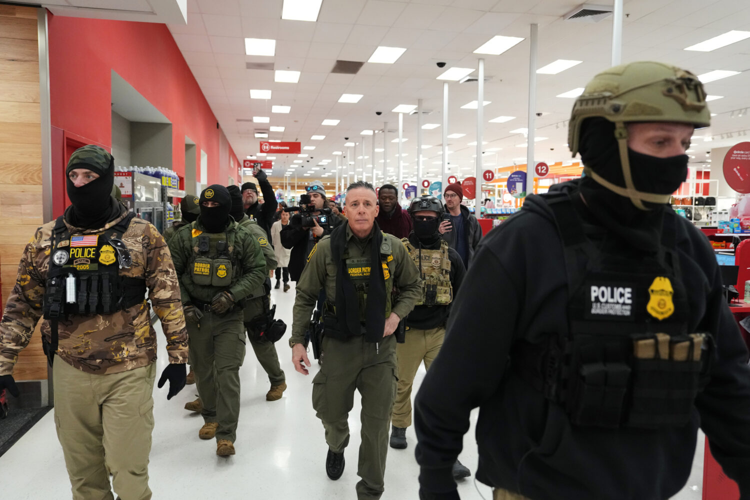 FILE - U.S. Border Patrol Cmdr. Gregory Bovino walks through a Target store Jan. 11, 2026, in St. P...