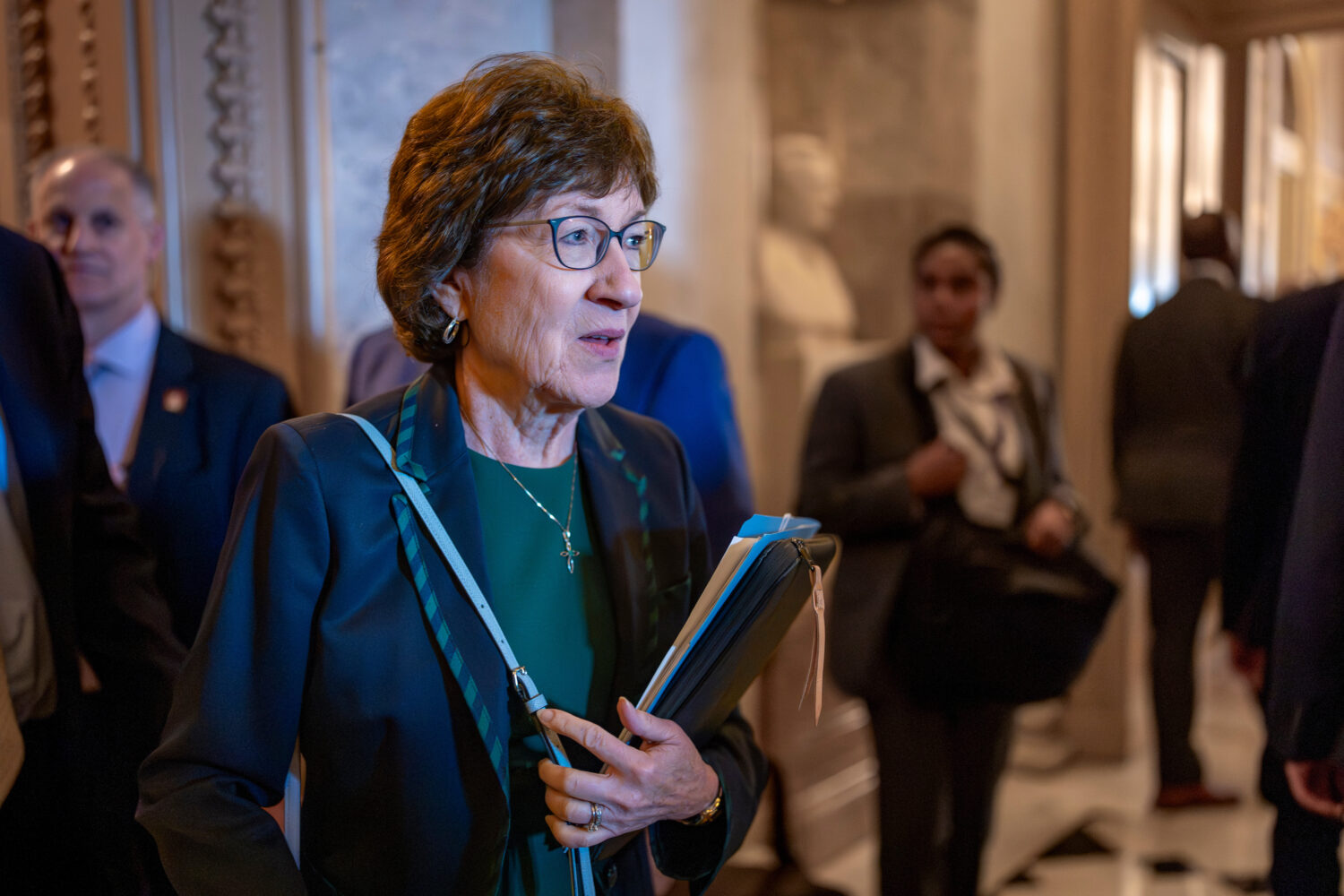 FILE - Sen. Susan Collins, R-Maine, departs the chamber at the Capitol in Washington, on July 24, 2...