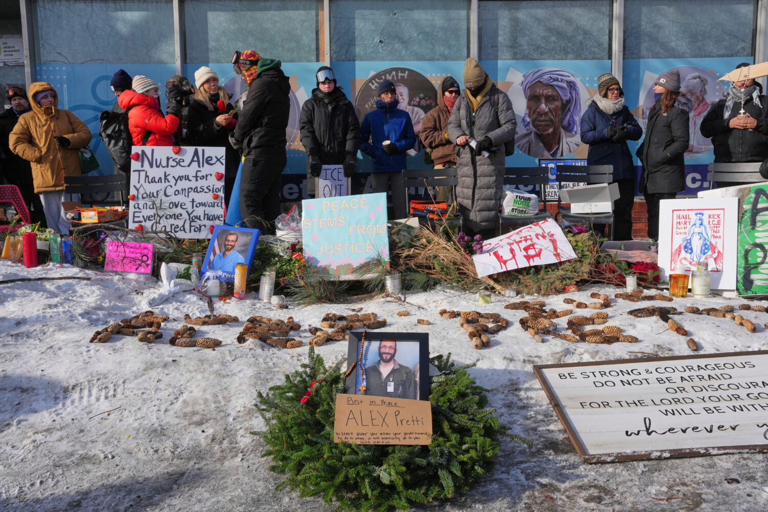 People gather near the scene where Alex Pretti was fatally shot by a U.S. Border Patrol officer yes...