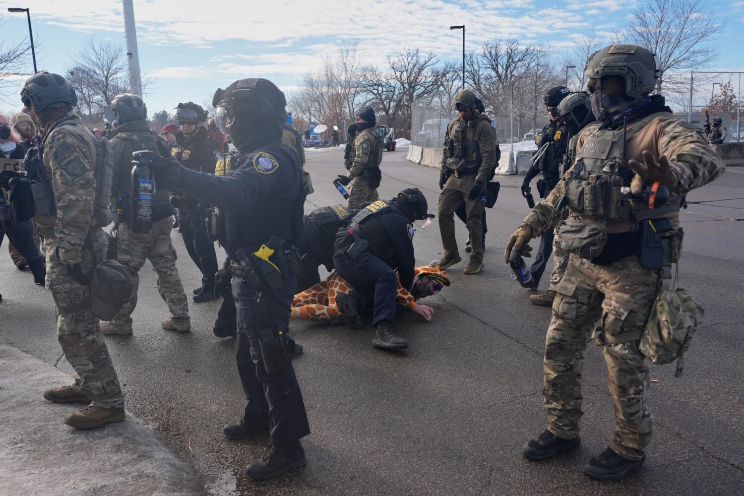 Protesters demonstrate against Immigration and Customs Enforcement (ICE) after Renee Good, who was ...