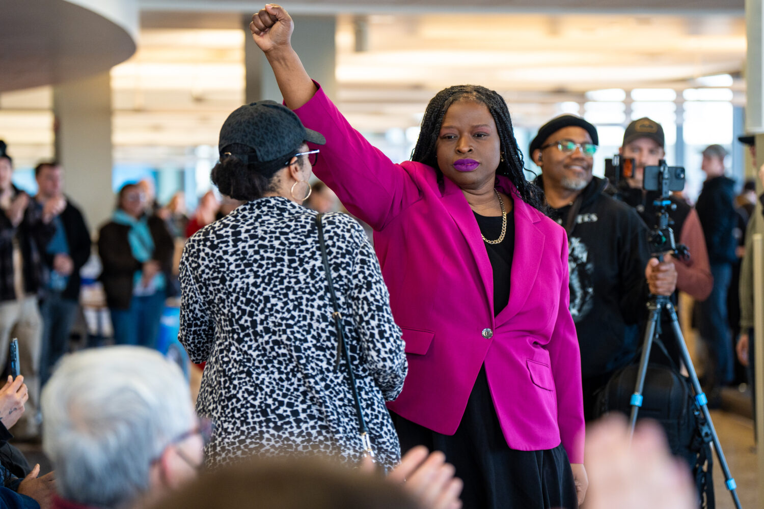FILE - Nekima Levy Armstrong holds up her fist after speaking at an anti-ICE rally for Martin Luthe...