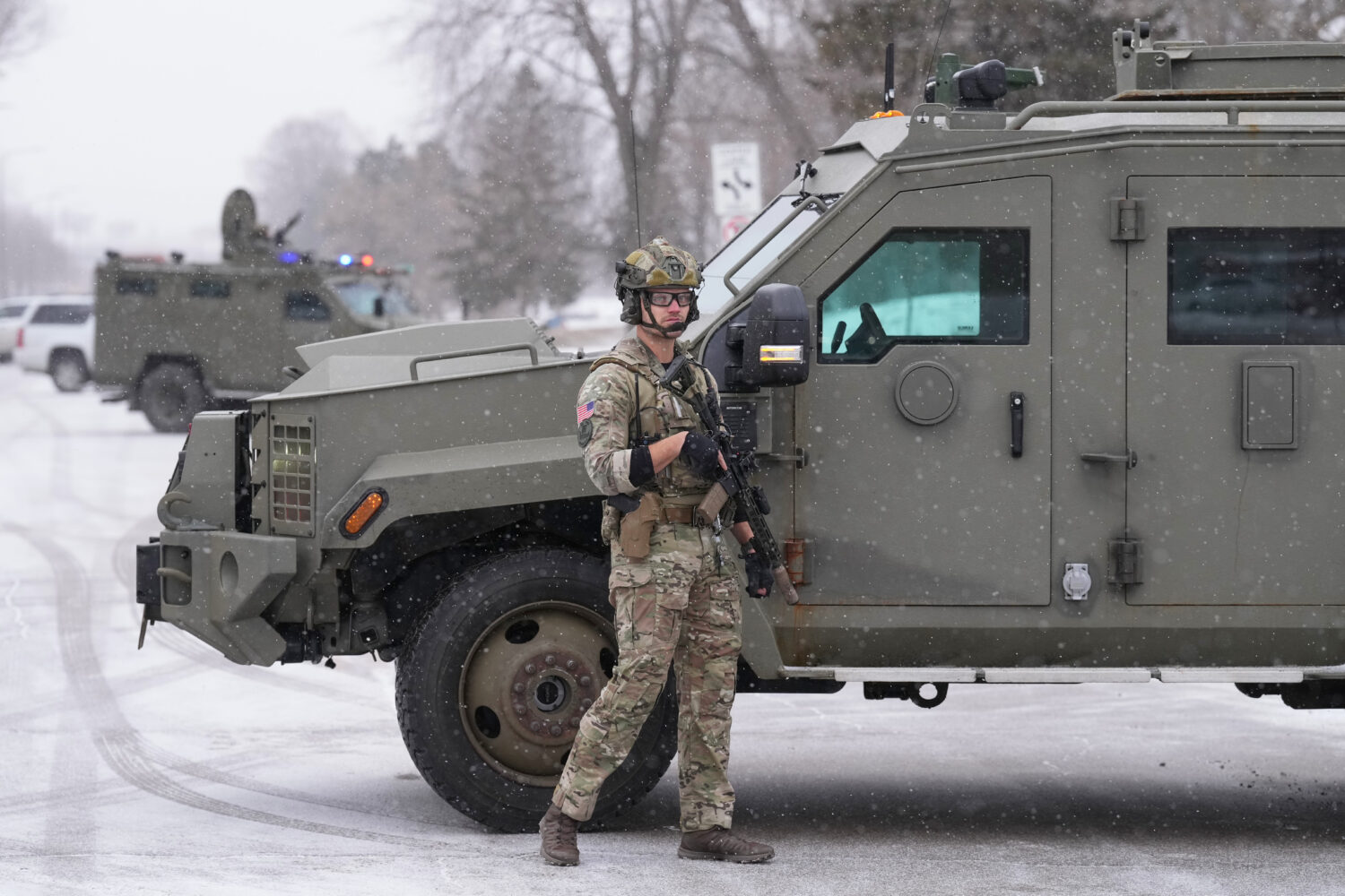 An FBI officer works the scene during operations on Friday, Jan. 16, 2026, in St. Paul, Minn. (AP P...
