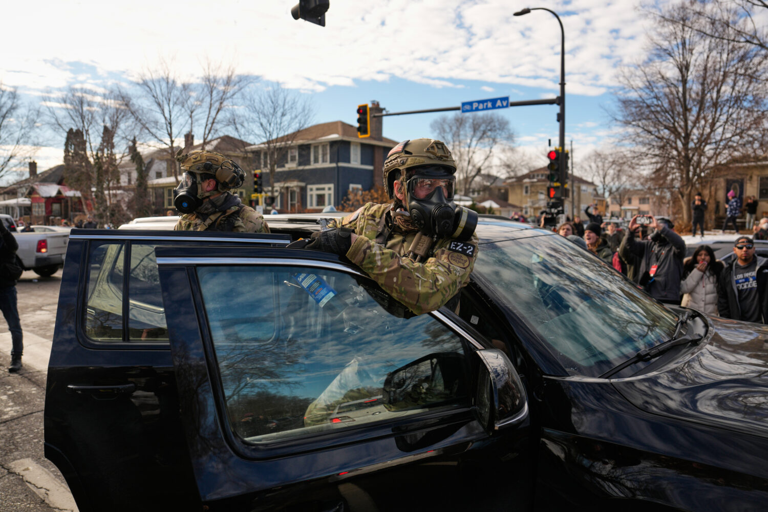 Federal immigration officers get in a car to leave a scene Monday, Jan. 12, 2026, in Minneapolis. (...
