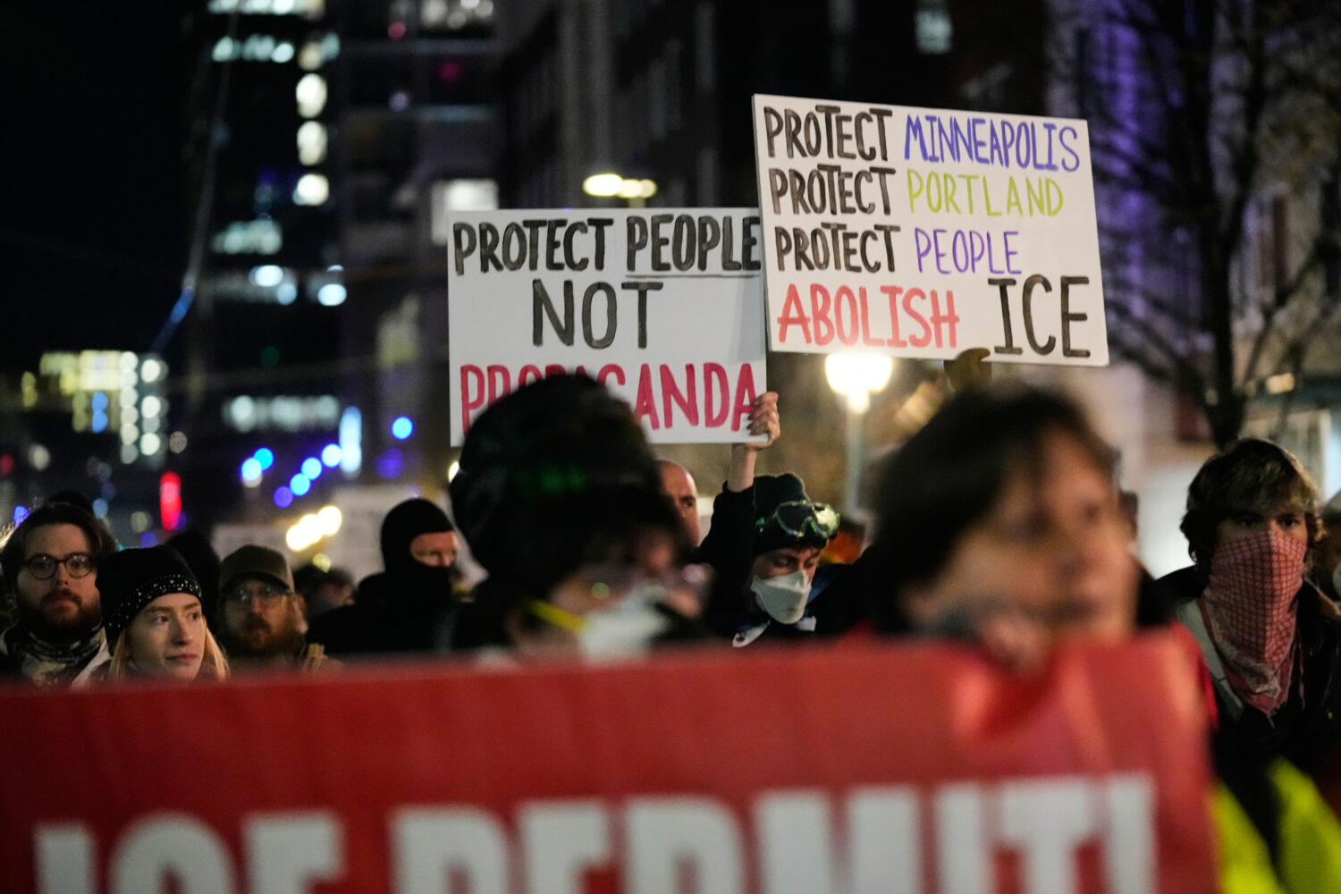 People march to the U.S. Immigration and Customs Enforcement facility in honor of victims of ICE sh...
