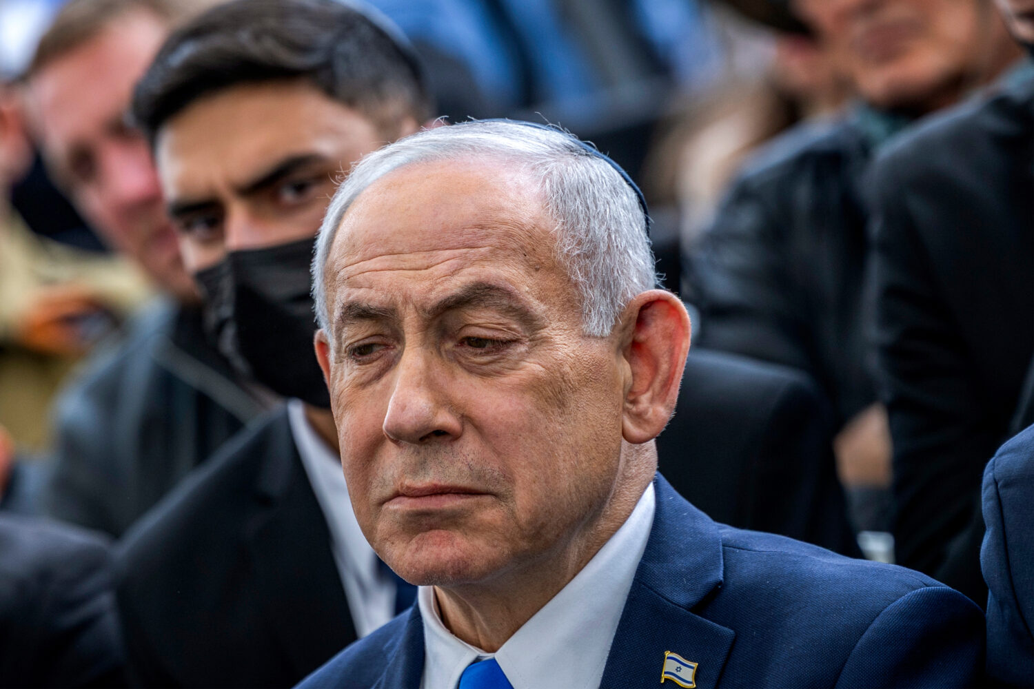 Israel's Prime Minister Benjamin Netanyahu reacts during the funeral of Israeli hostage Ran Gvili, ...