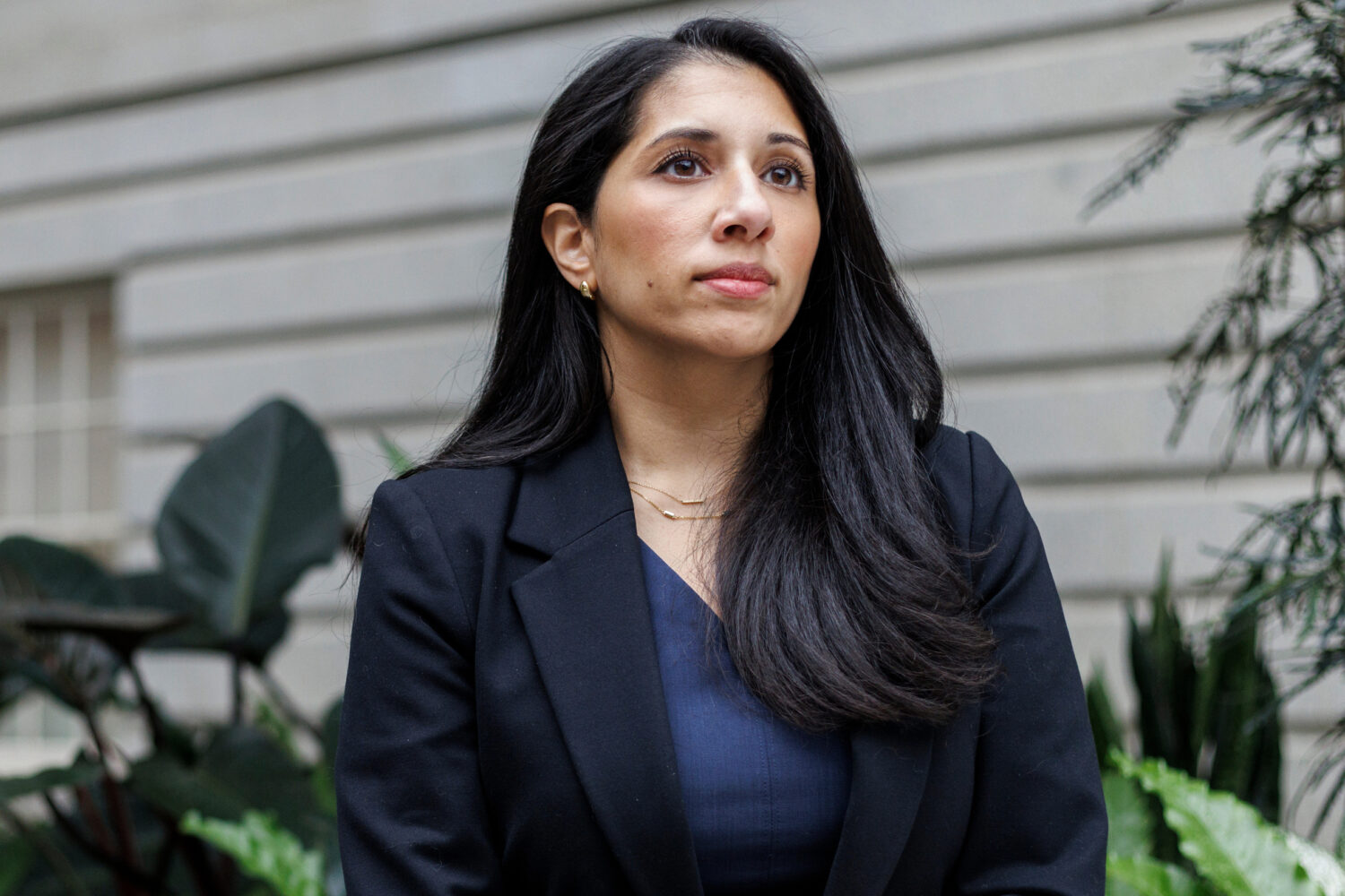 Anam Petit, a former Justice Department employee, poses for a portrait in the Robert and Arlene Kog...