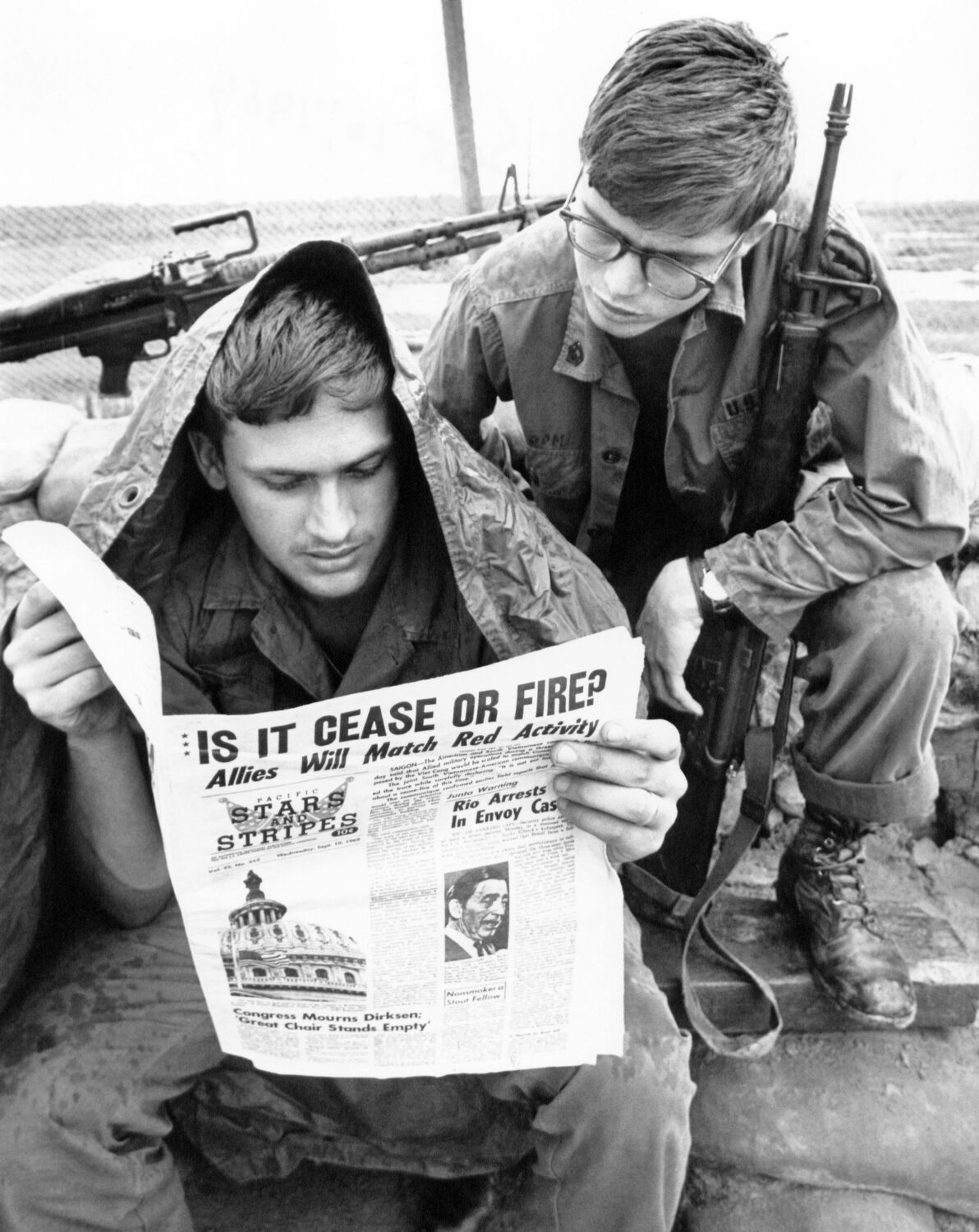FILE - A GI with the U.S. 25th division reads Stars and Stripes newspaper at Cu Chi, South Vietnam ...