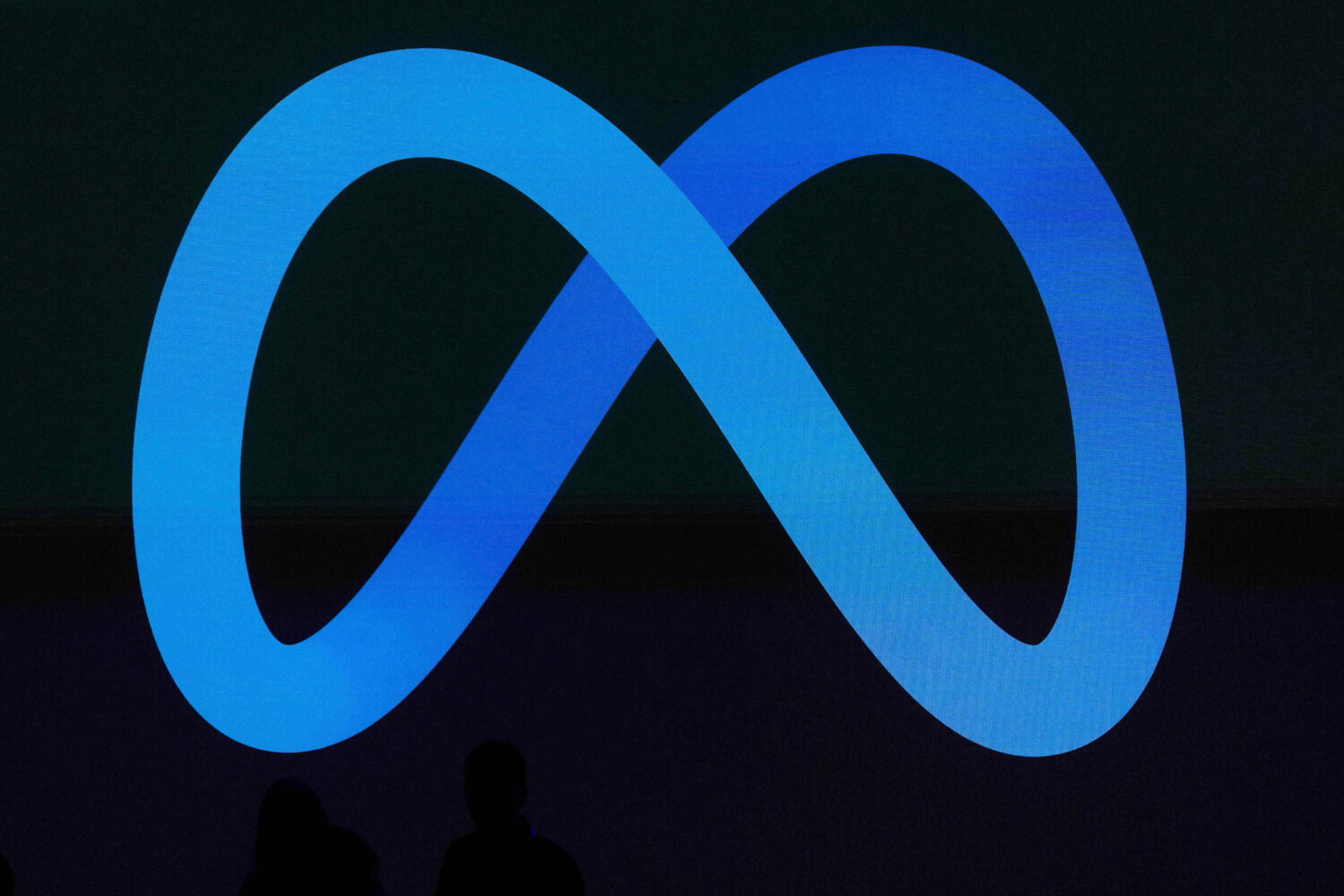 FILE -A Meta logo is shown on a video screen at LlamaCon 2025, an AI developer conference, in Menlo...