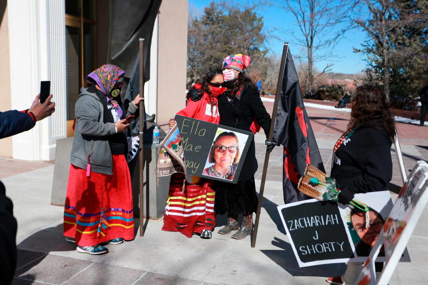FILE - Seraphine Warren, center left, is embraced by state New Mexico state Sen. Shannon Pinto whil...