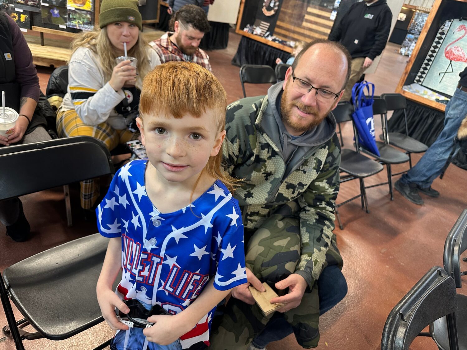 Ben Barley, a 7-year-old first-grader from Red Lion, Pa., waits with his father, Robert Barley, for...