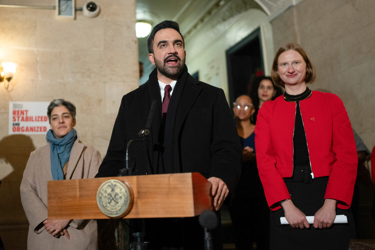 New York Mayor Zohran Mamdani, center, speaks during a news conference with Cea Weaver, right, Thur...