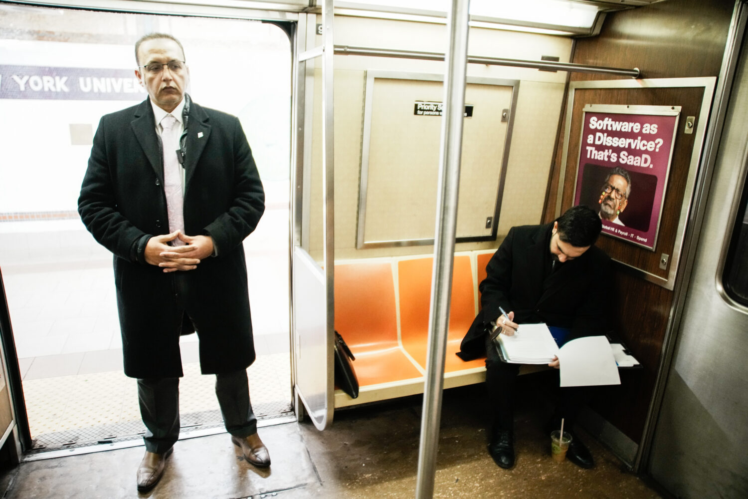 New York City Mayor Zohran Mamdani checks his agenda on the subway on his way to City Hall in New Y...