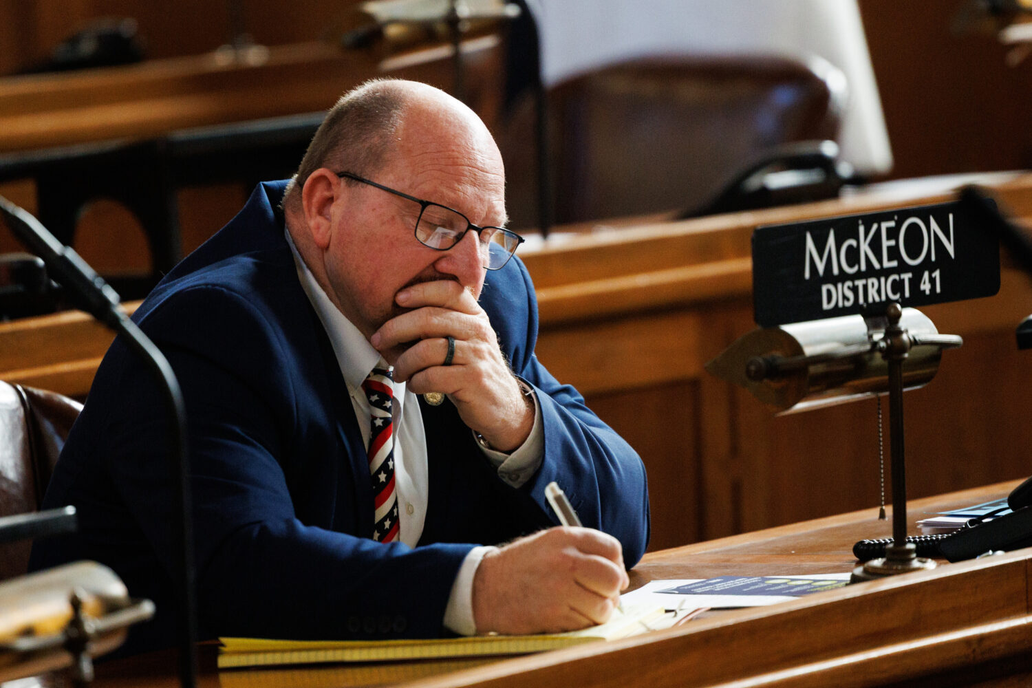 State Sen. Daniel McKeon takes notes during the first day of Nebraska's 2026 legislative session, W...
