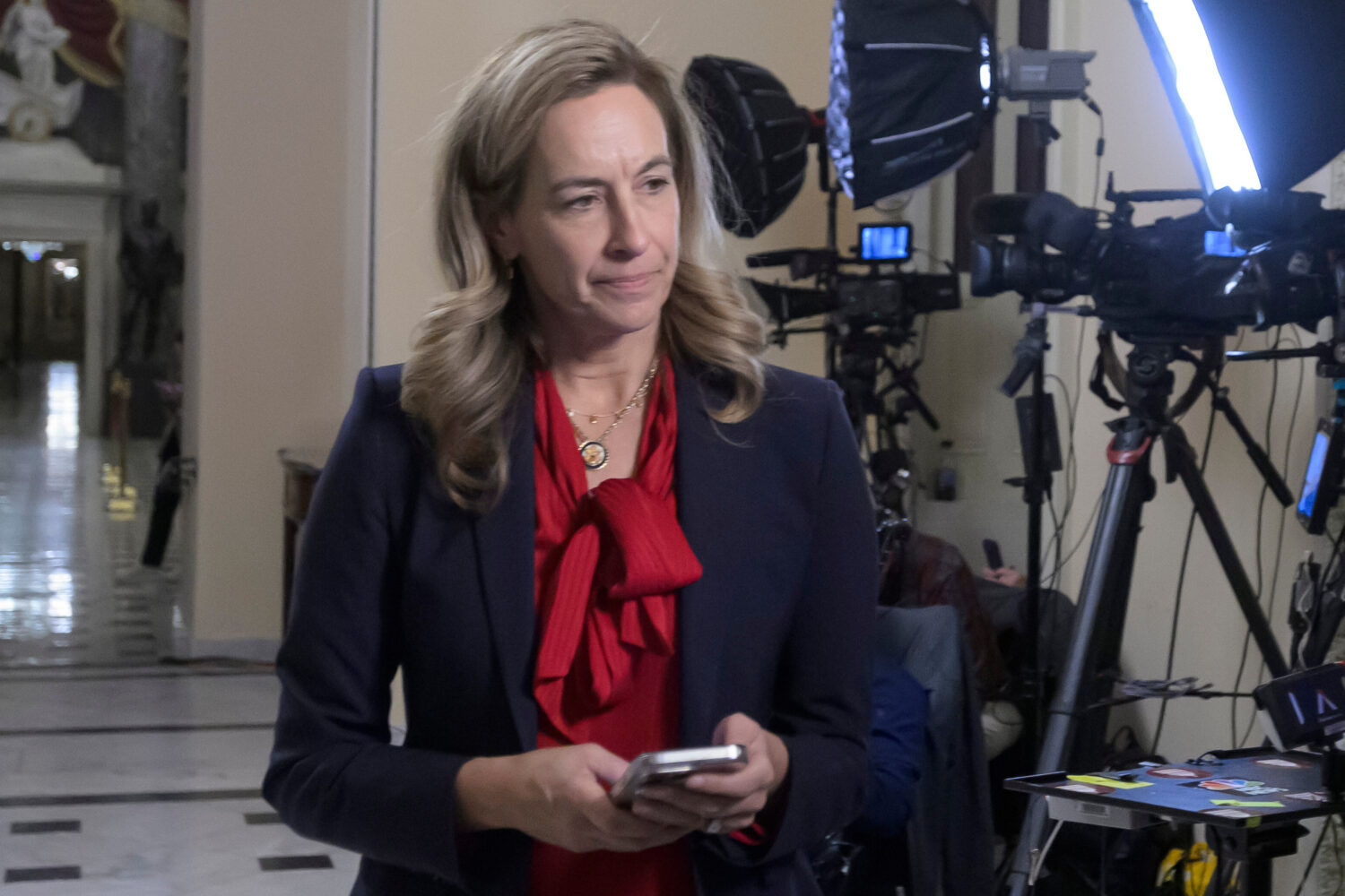 FILE - New Jersey Gov.-elect Rep. Mikie Sherrill, D-N.J., left, prepares for a television interview...