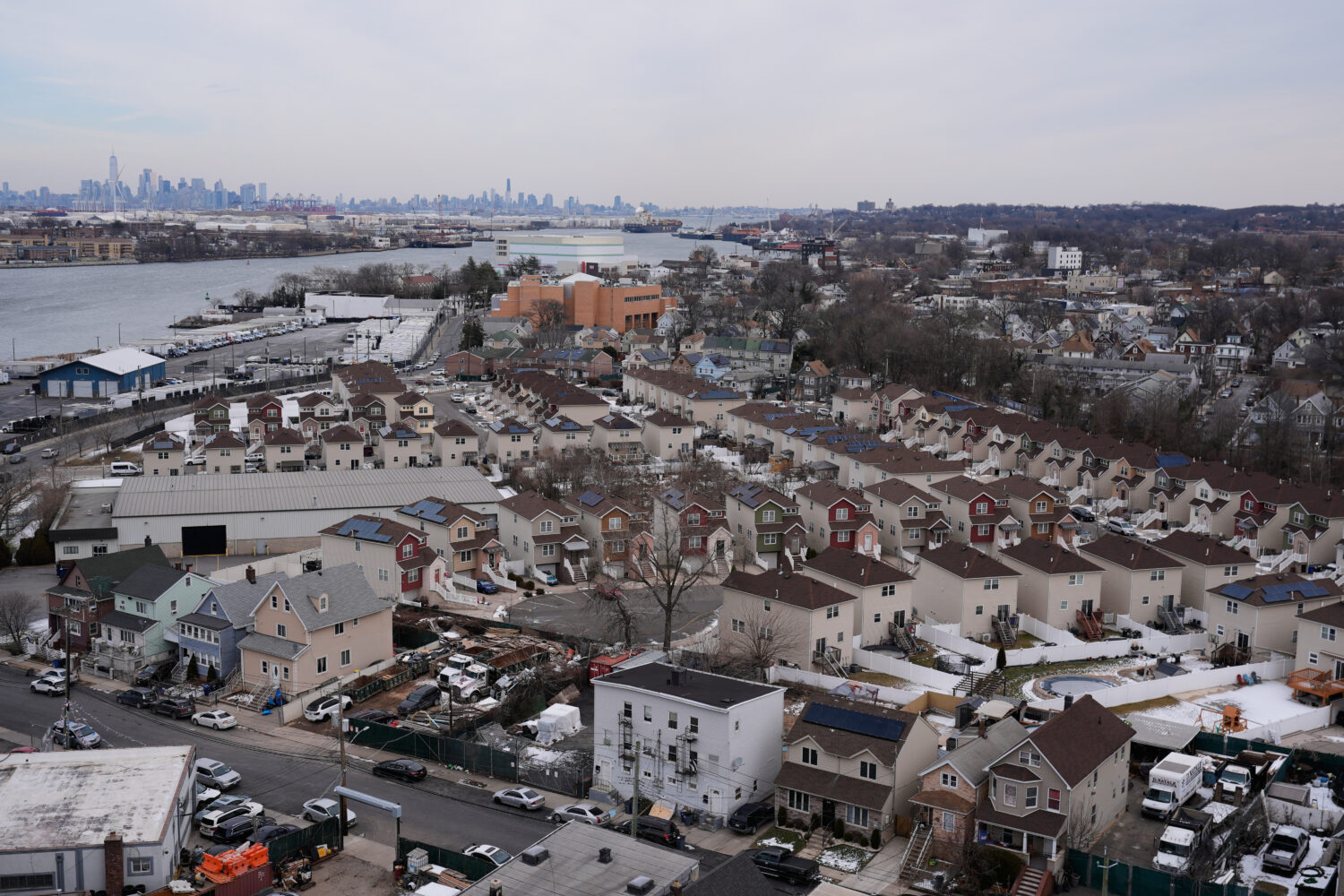 The skyline of lower Manhattan, top left, is seen behind the Staten Island borough of New York, Fri...