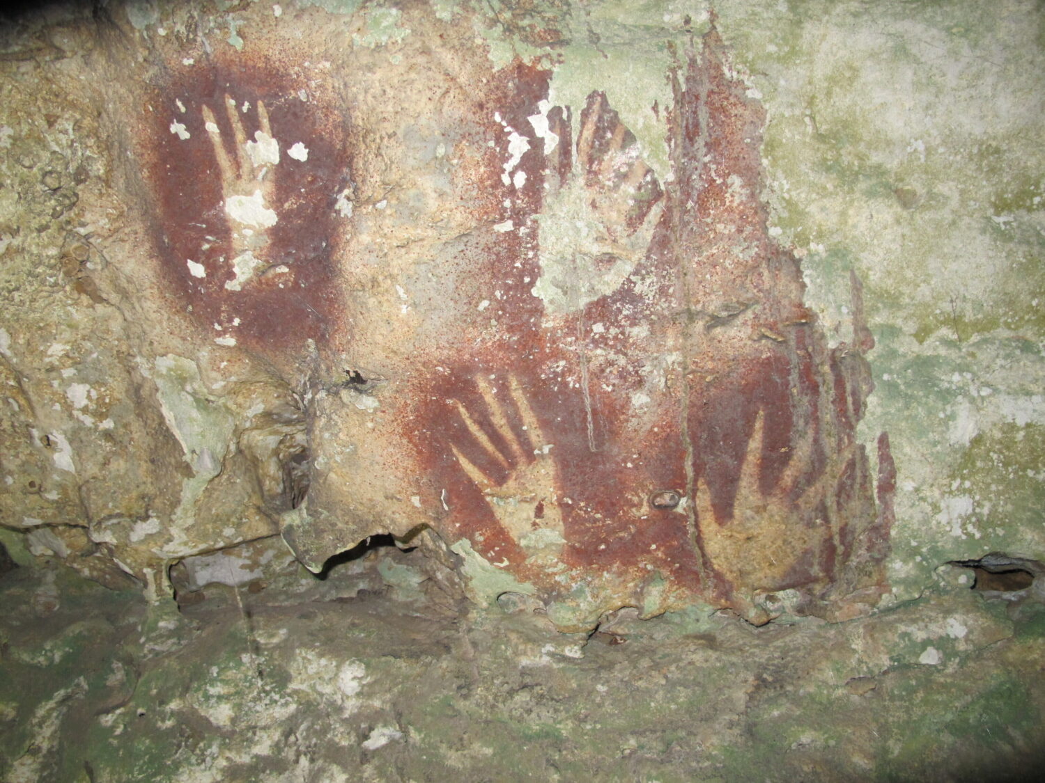 This undated image provided by Maxime Aubert shows handprints with sharpened fingertips in the Maro...