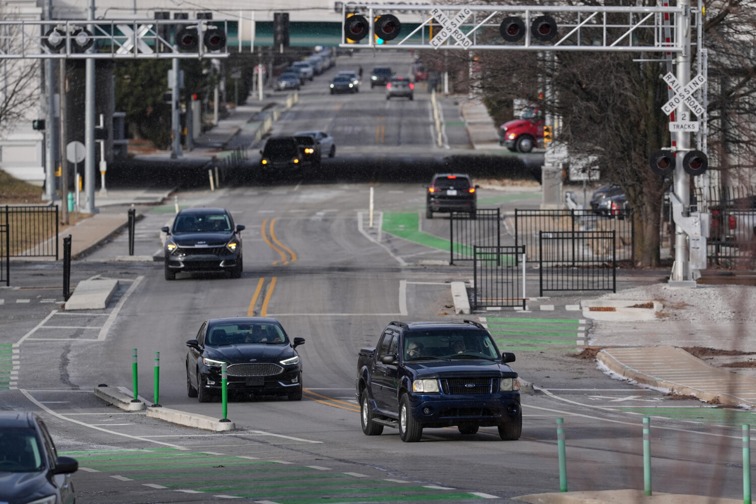 Cars make their way onto the recently converted two-way portion of Michigan Street in Indianapolis,...