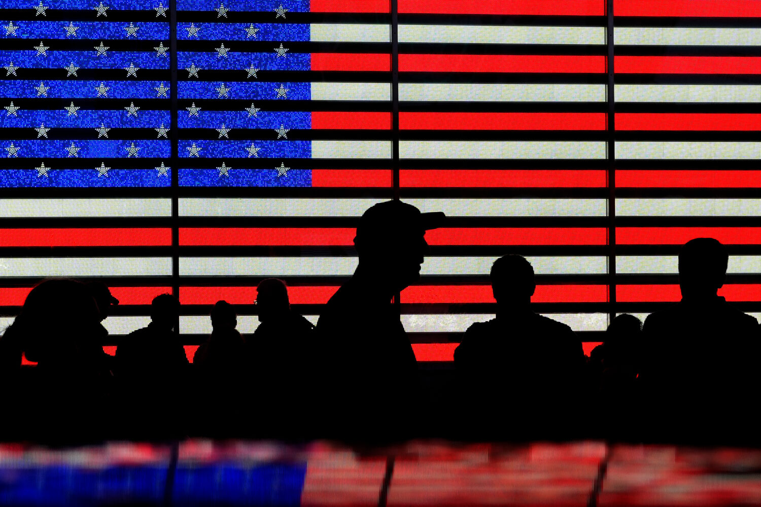 FILE - People stand in Times Square in New York, Aug. 9, 2024. (AP Photo/Pamela Smith, File)Credit:...