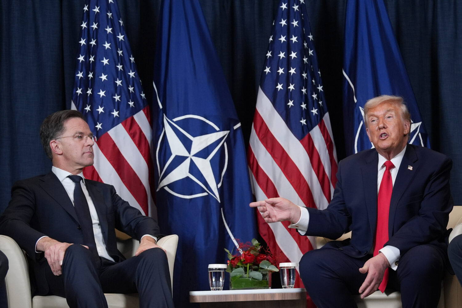 FILE - President Donald Trump, right, meets with NATO Secretary General Mark Rutte on the sidelines...