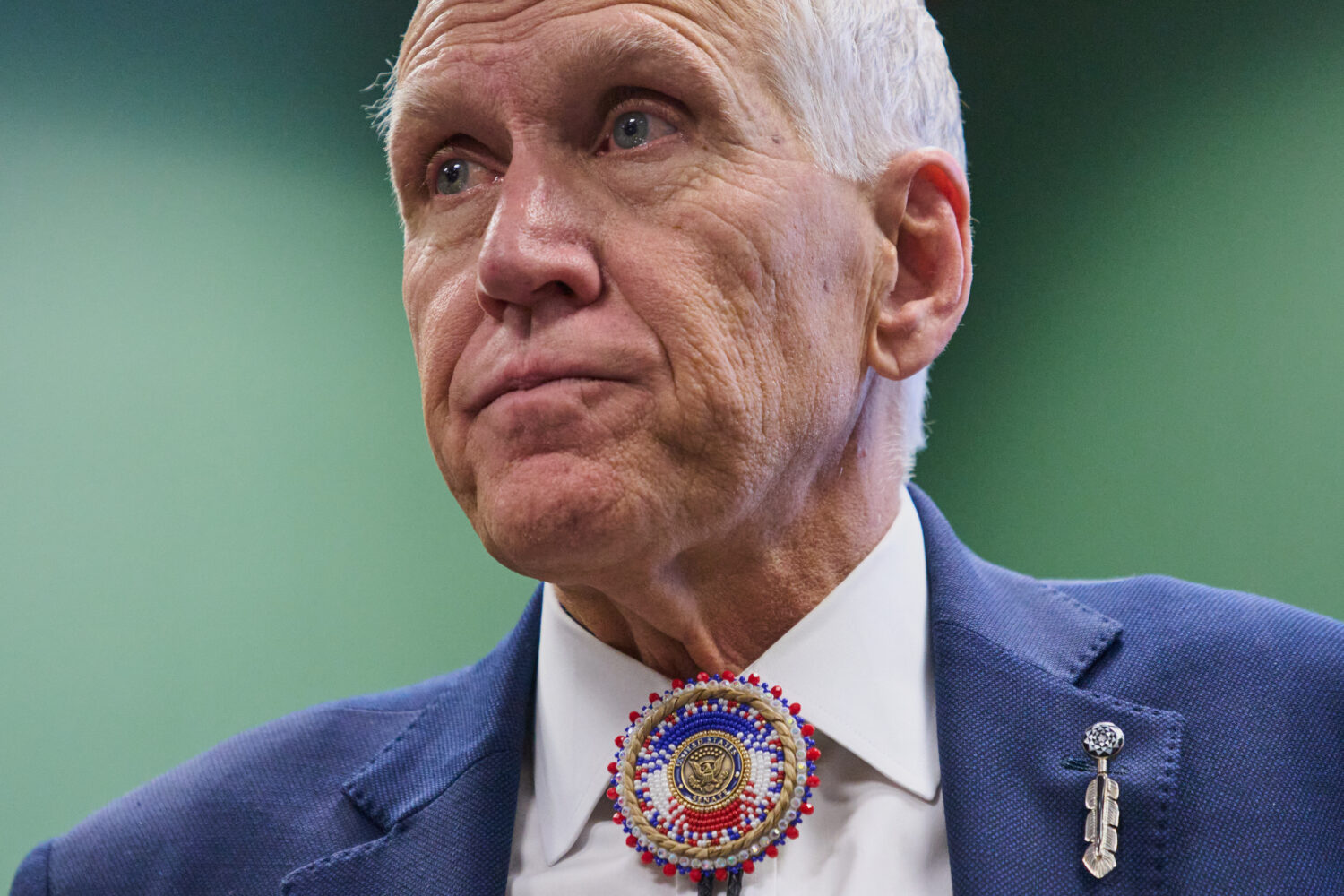 FILE - Wearing a beaded bolo around a pin that says "United States Senate," Sen. Thom Tillis, R-N.C...