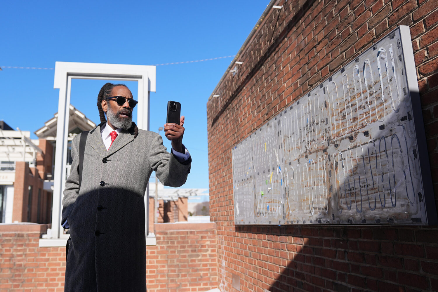Attorney Michael Coard makes a social media post at the now removed explanatory panels that were pa...
