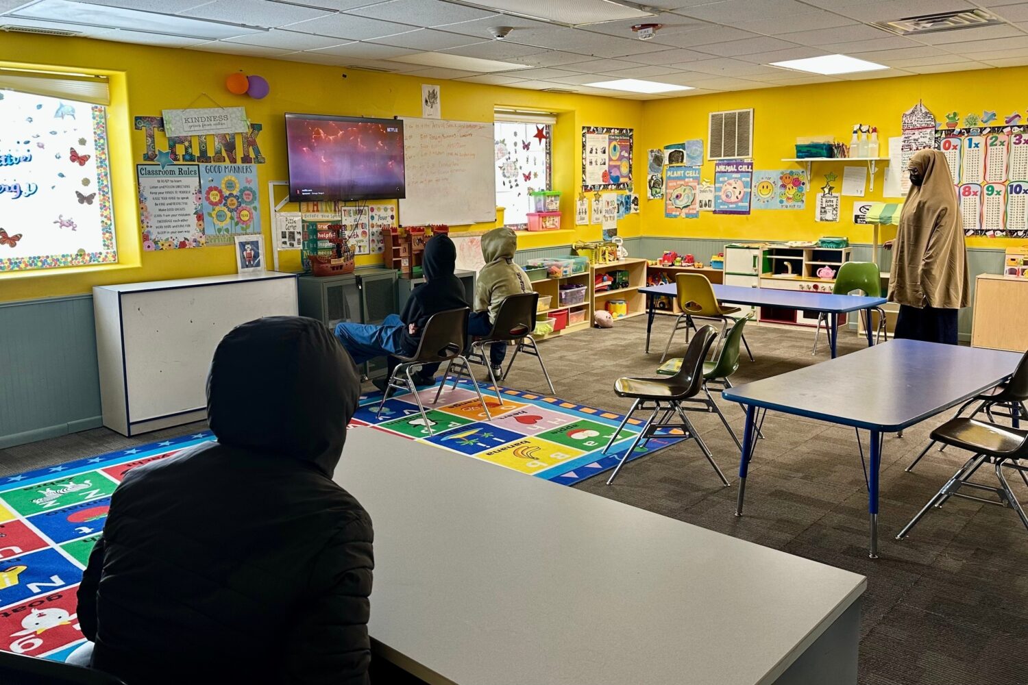 FILE - Children watch television at ABC Learning Center in Minneapolis, Minn., Dec. 31, 2025. (AP P...