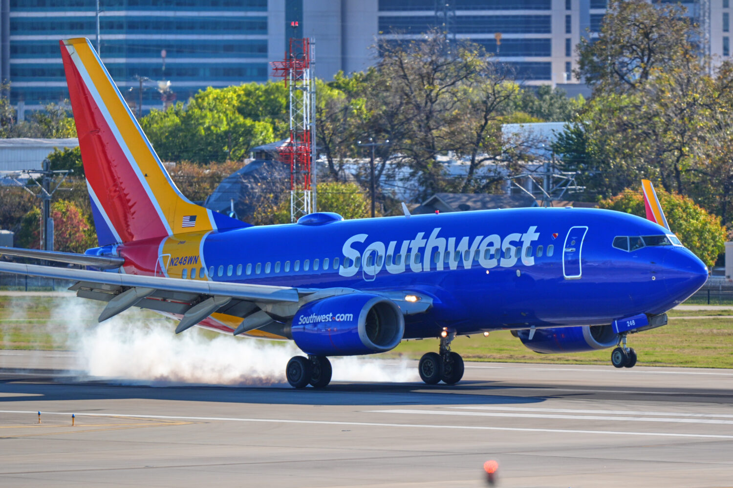 FILE - A Southwest Airlines plane lands at Love Field Airport, Nov. 26, 2025, in Dallas. (AP Photo/...