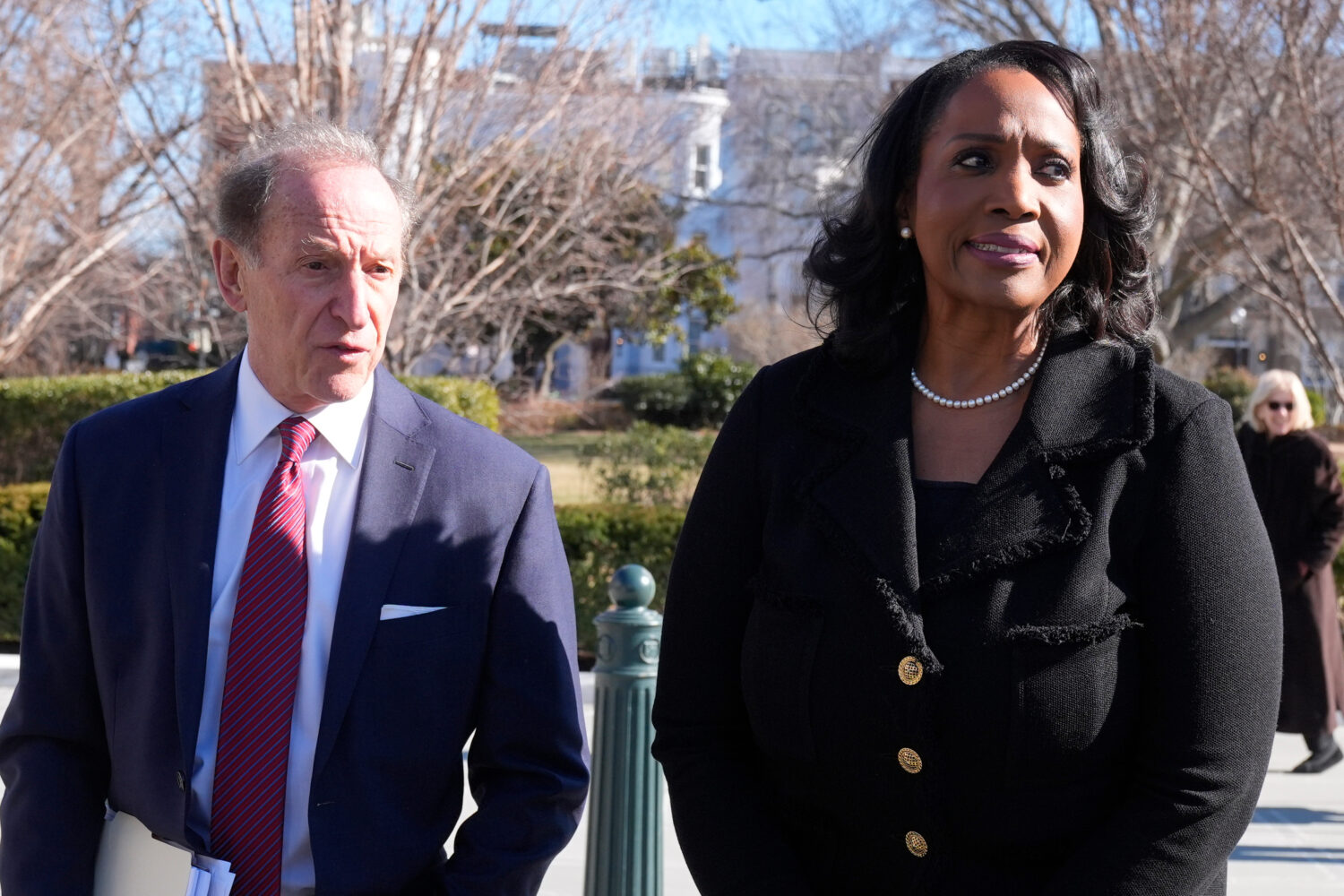 Federal Reserve governor Lisa Cook and attorney Abbe Lowell leave the Supreme Court in Washington, ...