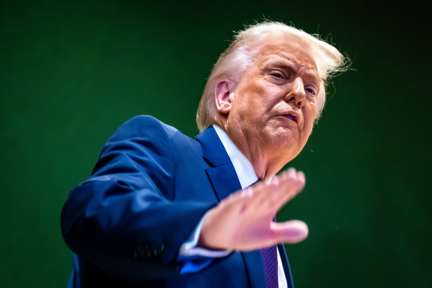 U.S. President Donald Trump gestures as he climbs a staircase after a signing ceremony of his Board...