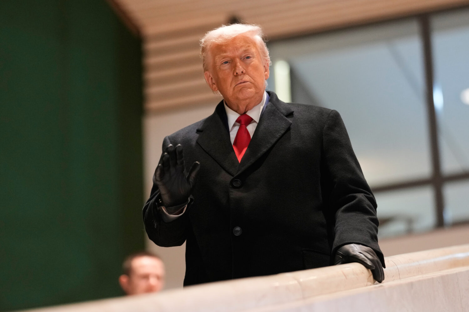 President Donald Trump walks down the stairs after a meeting during the Annual Meeting of the World...
