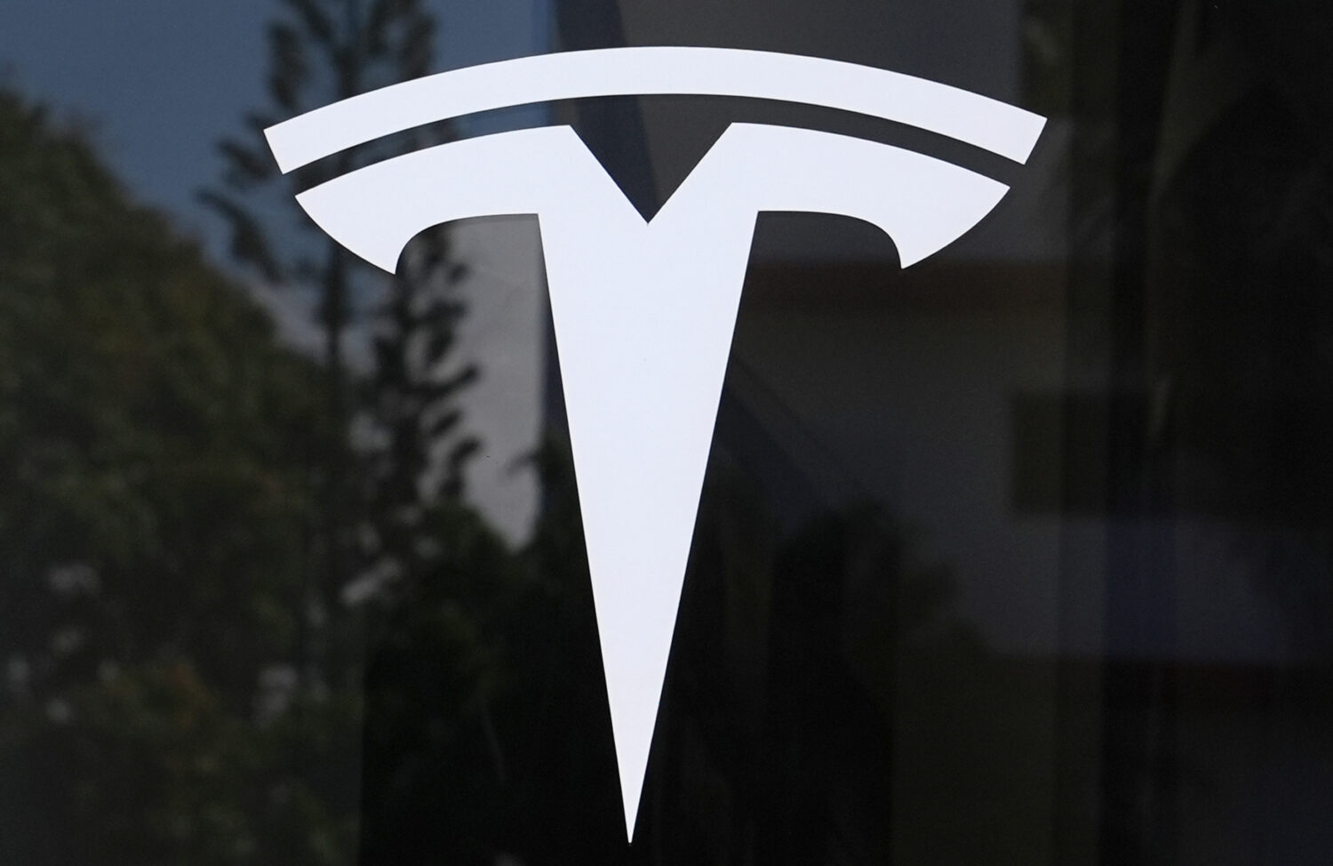 FILE - The Tesla logo is displayed at a Tesla dealership Thursday, Mar. 13, 2025, in Miami. (AP Pho...