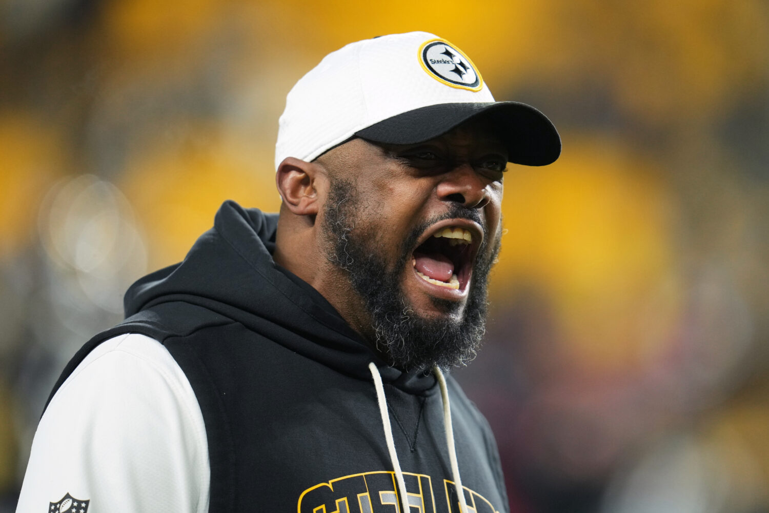 Pittsburgh Steelers head coach Mike Tomlin yells before an NFL wild-card playoff football game agai...