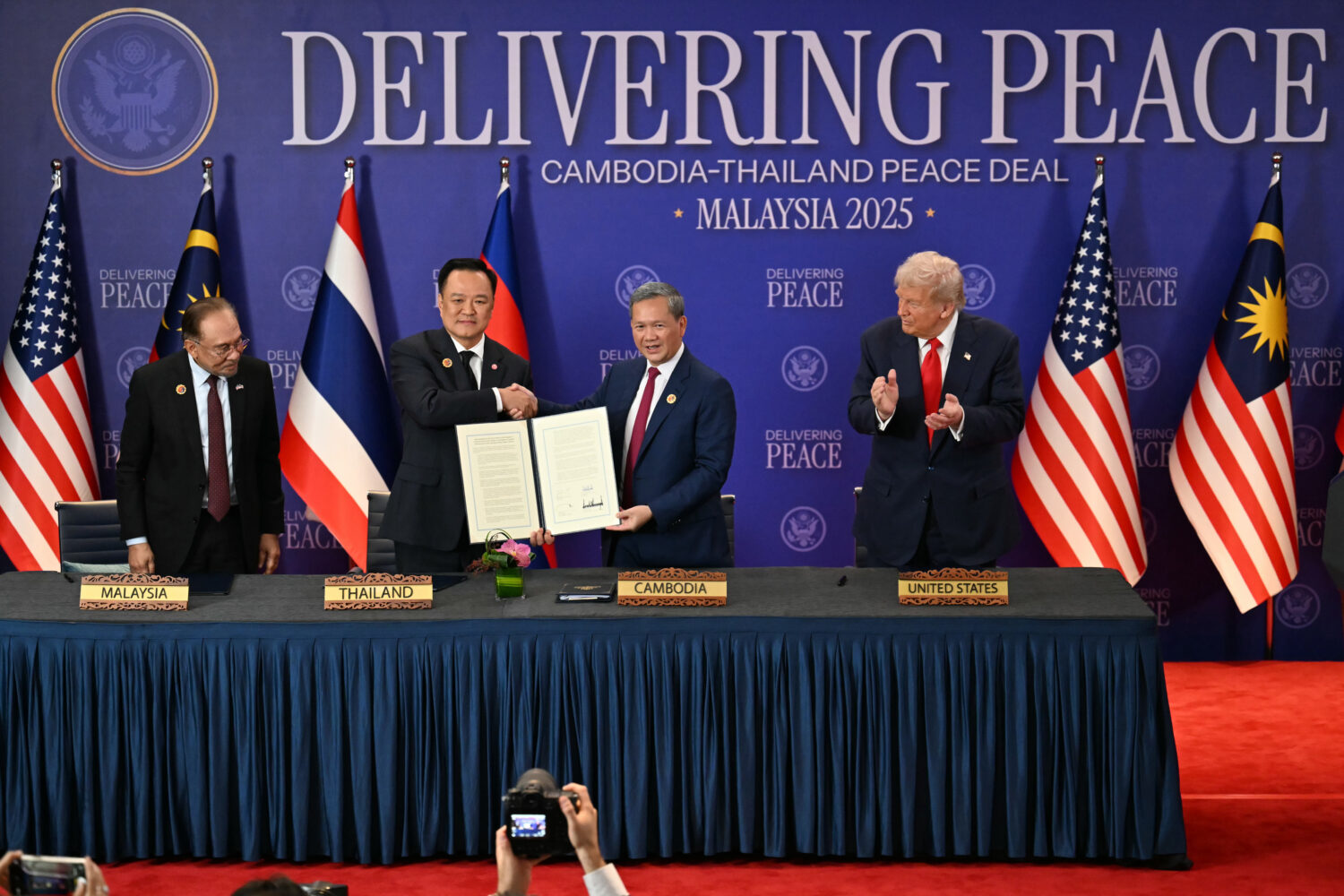 FILE - Malaysia's Prime Minister Anwar Ibrahim, left, and U.S. President Donald Trump, right, watch...