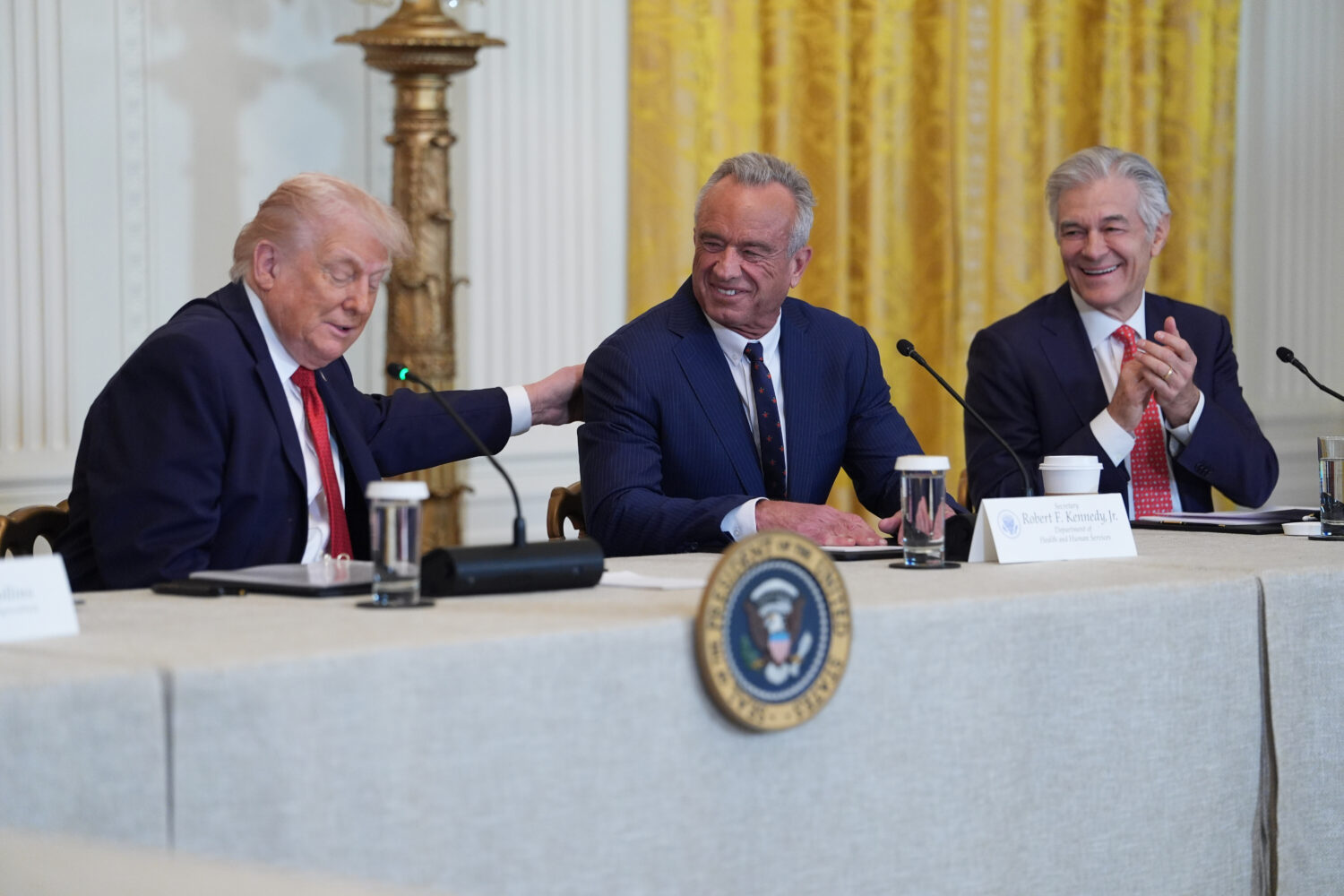 President Donald Trump attends an event to promote investment in rural health care in the East Room...