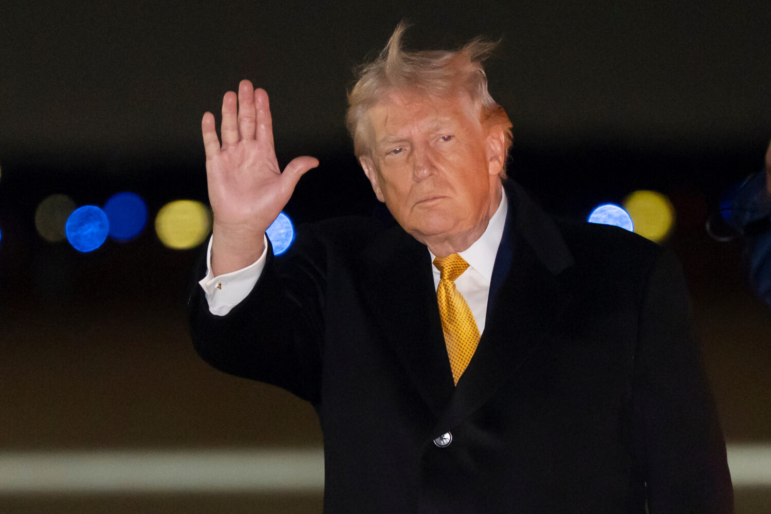 President Donald Trump waves as he arrives on Air Force One, Sunday, Jan. 4, 2026, at Joint Base An...